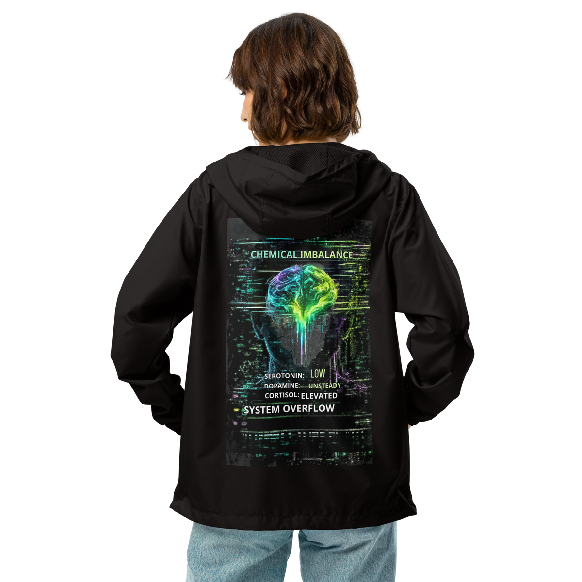Model wearing black Spectrum Leak windbreaker showing large neon brain and Chemical Imbalance graphic across the back.
