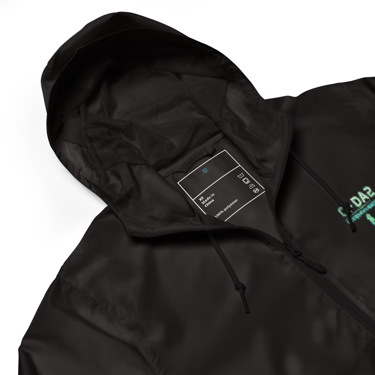 Close-up of black Spectrum Leak windbreaker showing mesh-lined hood, zipper, and CI-DA2 chest graphic.