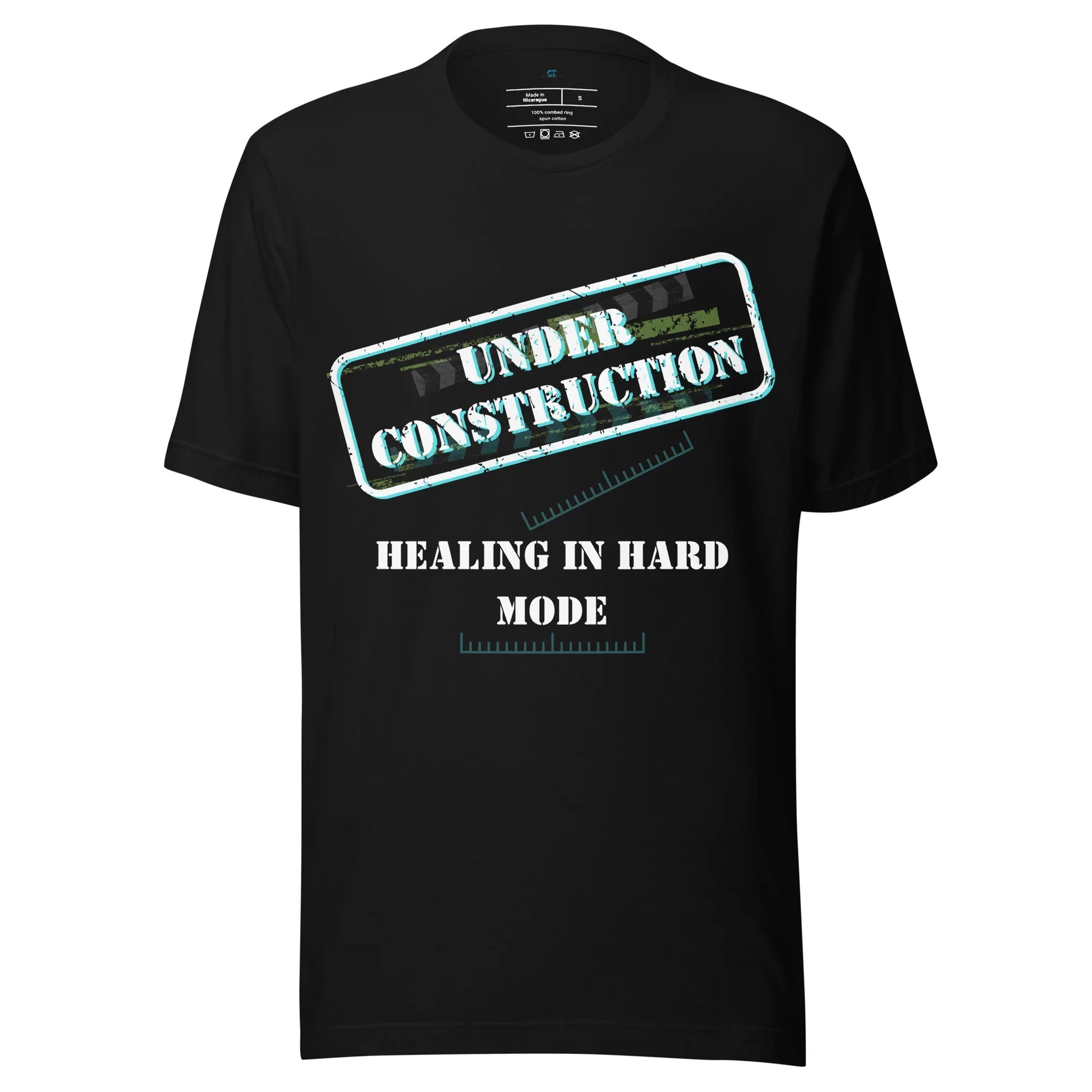 Front view of Healing in Hard Mode Graphic Tee with recovery statement artwork and mental health streetwear design