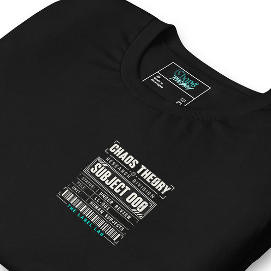 Close-up of black Clinically Complicated tee with Chaos Theøry Research Division Subject 00Ø chest graphic.